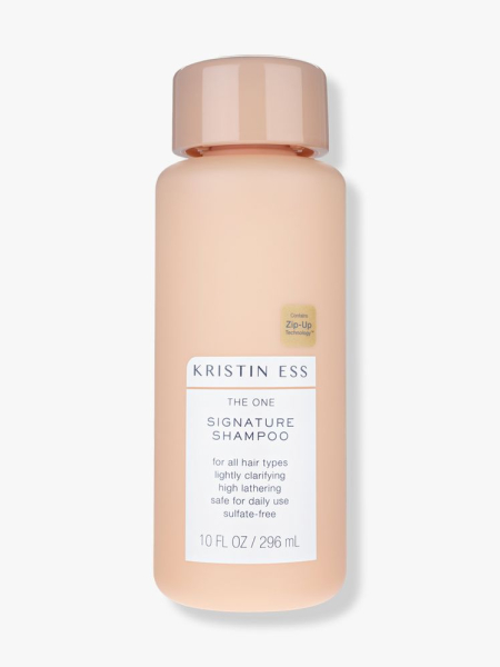 Kristin Ess The One Signature Shampoo peach bottle of shampoo on light gray background